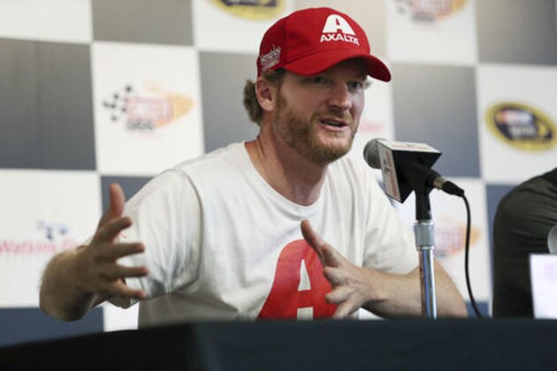 Dale Earnhardt Jr. answers a question about his concussion while addressing the media at Watkins Glen International racetrack during practice for Sunday's NASCAR Sprint Cup Series auto race Friday, Aug. 5, 2016, in Watkins Glen, N.Y. Jeff Gordon came out of retirement to fill in for the injured Dale Earnhardt Jr. (AP Photo/Mel Evans)