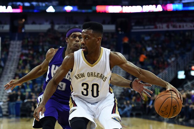 NEW ORLEANS, LA - JANUARY 28:  Norris Cole #30 of the New Orleans Pelicans is defended by Rajon Rondo #9 of the Sacramento Kings during a game at the Smoothie King Center on January 28, 2016 in New Orleans, Louisiana. The Pelicans defeated the Kings 114-105. NOTE TO USER: User expressly acknowledges and agrees that, by downloading and or using this photograph, User is consenting to the terms and conditions of the Getty Images License Agreement.  (Photo by Stacy Revere/Getty Images)