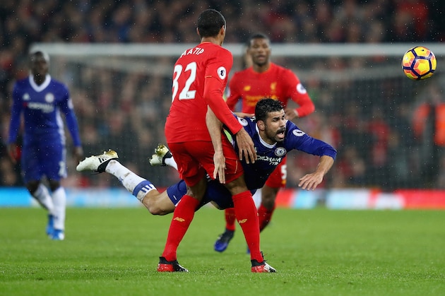 LIVERPOOL, ENGLAND - JANUARY 31:  Diego Costa of Chelsea and Joel Matip of Liverpool compete for the ball during the Premier League match between Liverpool and Chelsea at Anfield on January 31, 2017 in Liverpool, England.  (Photo by Clive Mason/Getty Images)