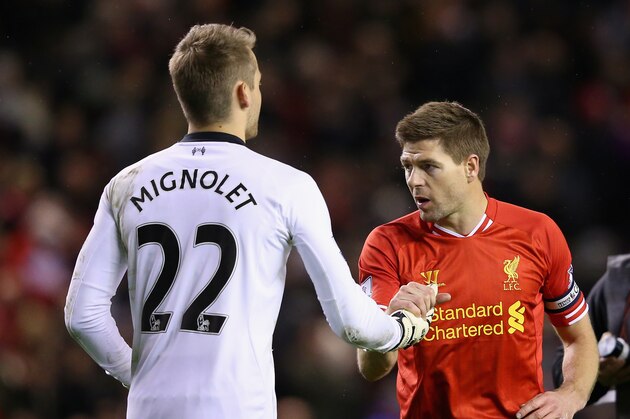LIVERPOOL, ENGLAND - MARCH 26:  Steven Gerrard of Liverpool celebrates with team-mate Simon Mignolet at the end of the Barclays Premier League match between Liverpool and Sunderland at Anfield on March 26, 2014 in Liverpool, England.  (Photo by Alex Livesey/Getty Images)