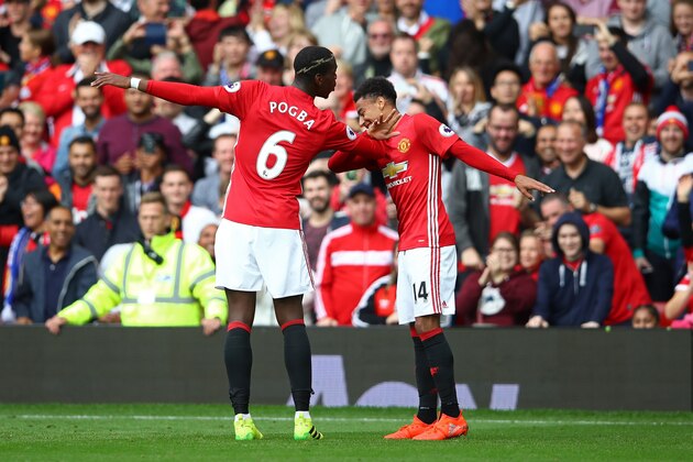 MANCHESTER, ENGLAND - SEPTEMBER 24: Paul Pogba of Manchester United (L) celebrates scoring his sides fourth goal with Jesse Lingard of Manchester United (R) during the Premier League match between Manchester United and Leicester City at Old Trafford on September 24, 2016 in Manchester, England.  (Photo by Clive Brunskill/Getty Images)