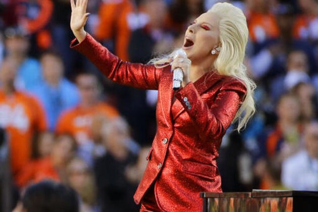 FILE - In this Feb. 7, 2016, file photo, Lady Gaga sings the national anthem before the NFL Super Bowl 50 football game in Santa Clara, Calif. Lady Gaga is reportedly planning an (unconfirmed) stunt during Super Bowl 51 by performing from the roof of the stadium during the big game. Advertisers are also ramping up their marketing stunts to try to stand out from the crowd during the biggest live TV event of the year, when the Atlanta Falcons will take on the New England Patriots, in the Super Bowl, on Sunday, Feb. 5, 2017. (AP Photo/Jae C. Hong, File)