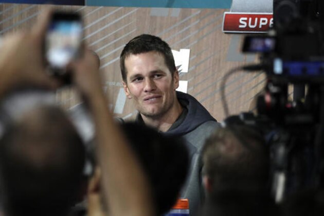 New England Patriots' Tom Brady answers questions during opening night for the NFL Super Bowl 51 football game at Minute Maid Park Monday, Jan. 30, 2017, in Houston. (AP Photo/Charlie Riedel)