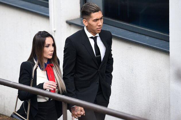 Liverpool's Brazilian midfielder Roberto Firmino and wife Larissa Pereira arrive at Liverpool Magistrates Court in Liverpool, north-west England on February 1, 2017. 
Firmino is charged with drink driving after he was stopped by police in Liverpool city centre in the early hours of December 24 2016.  / AFP / PAUL ELLIS        (Photo credit should read PAUL ELLIS/AFP/Getty Images)