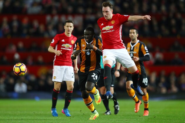 MANCHESTER, ENGLAND - FEBRUARY 01:  Phil Jones of Manchester United wins the ball from Oumar Niasse of Hull City during the Premier League match between Manchester United and Hull City at Old Trafford on February 1, 2017 in Manchester, England.  (Photo by Clive Mason/Getty Images)