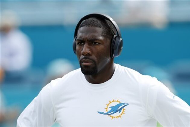 Miami Dolphins wide receiver Greg Jennings (85) listens to music as he warms up before an NFL football game against the Houston Texans, Sunday, Oct. 25, 2015 in Miami Gardens, Fla. (AP Photo/Joel Auerbach)