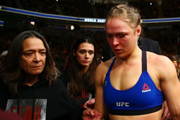 December 30, 2016; Las Vegas, NV, USA; Ronda Rousey leaves with her mother AnnMaria DeMars follwing her loss against Amanda Nunes during UFC 207 at T-Mobile Arena. Mandatory Credit: Mark J. Rebilas-USA TODAY Sports