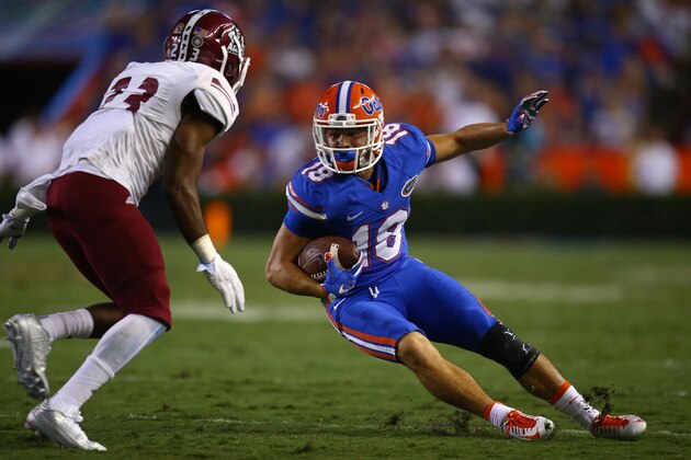 GAINESVILLE, FL - SEPTEMBER 05: Wide receiver C.J. Worton #18 of the Florida Gators slips as he is defended by defensive back Iman Chatman #26 of the New Mexico State Aggies during the second half of the game at Ben Hill Griffin Stadium on September 5, 2015 in Gainesville, Florida.  (Photo by Rob Foldy/Getty Images)