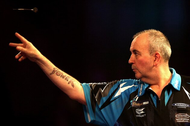 LONDON, ENGLAND - DECEMBER 18:  Phil Taylor of England throws during his first round match against David Platt of England  during Day Four of the 2017 William Hill PDC World Darts Championships  at Alexandra Palace on December 18, 2016 in London, England.  (Photo by Alex Pantling/Getty Images)