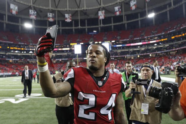 Atlanta Falcons running back Devonta Freeman (24) walks off the field after an NFL football divisional football game against the Seattle Seahawks, Saturday, Jan. 14, 2017, in Atlanta. The Falcons won 36-20. (AP Photo/John Bazemore)