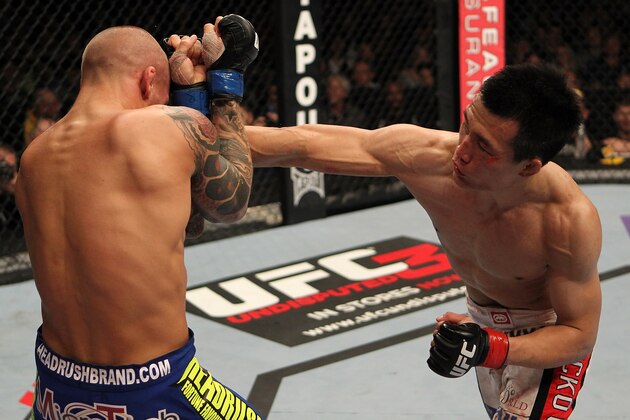 FAIRFAX, VA - MAY 15:  (R-L) 'The Korean Zombie' Chan Sung Jung punches Dustin Poirier in a featherweight bout during the UFC on Fuel TV event at Patriot Center on May 15, 2012 in Fairfax, Virginia.  (Photo by Josh Hedges/Zuffa LLC/Zuffa LLC via Getty Images)