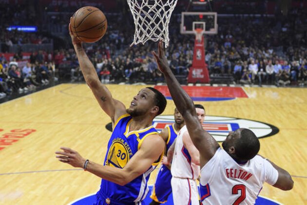 Golden State Warriors guard Stephen Curry, left, shoots as Los Angeles Clippers guard Raymond Felton defends during the first half of an NBA basketball game, Thursday, Feb. 2, 2017, in Los Angeles. (AP Photo/Mark J. Terrill)
