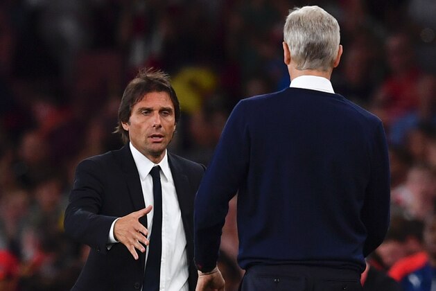 Chelsea's Italian head coach Antonio Conte (L) shakes hands on the touchline with Arsenal's French manager Arsene Wenger (R) at the end of the English Premier League football match between Arsenal and Chelsea at the Emirates Stadium in London on September 24, 2016.  / AFP / Ben STANSALL / RESTRICTED TO EDITORIAL USE. No use with unauthorized audio, video, data, fixture lists, club/league logos or 'live' services. Online in-match use limited to 75 images, no video emulation. No use in betting, games or single club/league/player publications.  /         (Photo credit should read BEN STANSALL/AFP/Getty Images)
