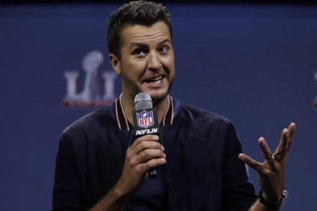 Luke Bryan answers questions at a news conference for the NFL Super Bowl 51 football game Thursday, Feb. 2, 2017, in Houston. (AP Photo/David J. Phillip)