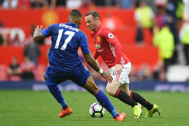 Manchester United's English striker Wayne Rooney (R) takes on Leicester City's English defender Danny Simpson (L) during the English Premier League football match between Manchester United and Leicester City at Old Trafford in Manchester, north west England, on September 24, 2016. / AFP / ANTHONY DEVLIN / RESTRICTED TO EDITORIAL USE. No use with unauthorized audio, video, data, fixture lists, club/league logos or 'live' services. Online in-match use limited to 75 images, no video emulation. No use in betting, games or single club/league/player publications.  /         (Photo credit should read ANTHONY DEVLIN/AFP/Getty Images)