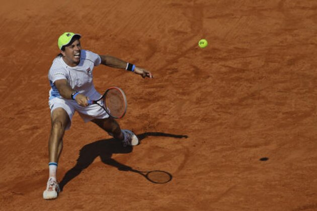 Argentina's Carlos Berlocq returns the ball to Italy's Andreas Seppi during a Davis Cup first round tennis match in Buenos Aires, Argentina, Friday, Feb. 3, 2017. (AP Photo/Natacha Pisarenko)