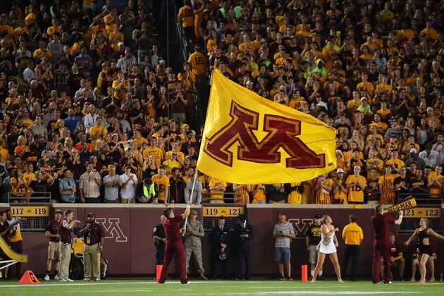 MINNEAPOLIS, MN - SEPTEMBER 01:  Minnesota Golden Gophers fans celebrate a touchdown against the Oregon State Beavers in the first quarter at TCF Bank Stadium on September 1, 2016 in Minneapolis, Minnesota. (Photo by Adam Bettcher/Getty Images)