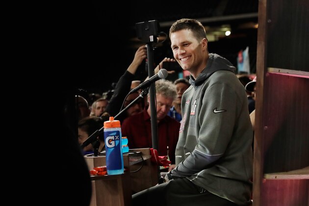 HOUSTON, TX - JANUARY 30:  Tom Brady #12 of the New England Patriots reacts as he speaks with the media during Super Bowl 51 Opening Night at Minute Maid Park on January 30, 2017 in Houston, Texas.  (Photo by Tim Warner/Getty Images)