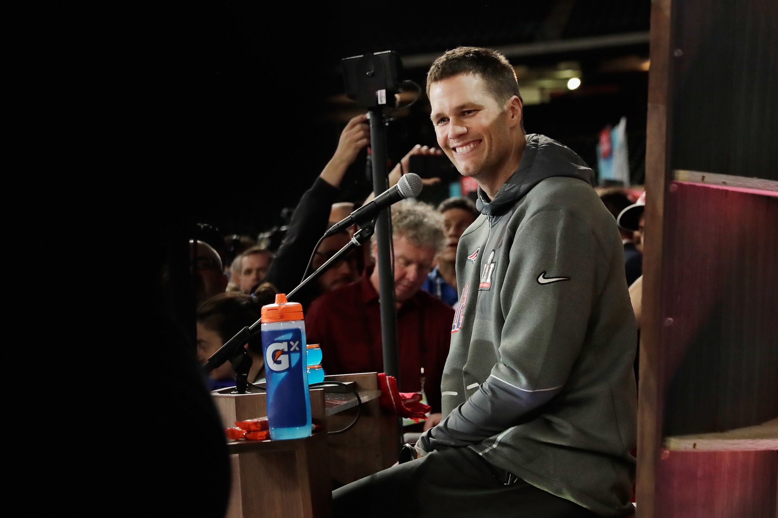 HOUSTON, TX - JANUARY 30:  Tom Brady #12 of the New England Patriots reacts as he speaks with the media during Super Bowl 51 Opening Night at Minute Maid Park on January 30, 2017 in Houston, Texas.  (Photo by Tim Warner/Getty Images)