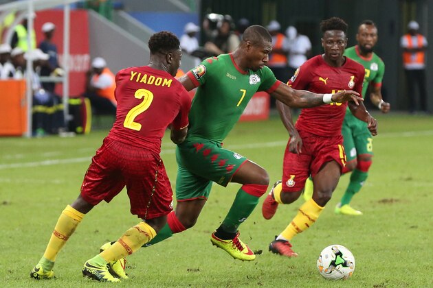 Burkina Faso's midfielder Prejuce Nakoulma (C) challenges Ghana's defender Andy Yiadom (L) and Ghana's midfielder Ebenezer Ofori during the 2017 Africa Cup of Nations third place football match between Burkina Faso and Ghana in Port-Gentil on February 4, 2017. / AFP / Steve JORDAN        (Photo credit should read STEVE JORDAN/AFP/Getty Images)