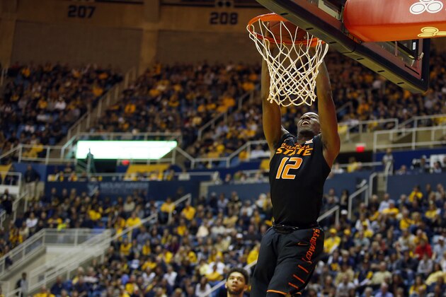 MORGANTOWN, WV - FEBRUARY 04:  Cameron McGriff #12 of the Oklahoma State Cowboys dunks the ball against the West Virginia Mountaineers at the WVU Coliseum on February 4, 2017 in Morgantown, West Virginia.  (Photo by Justin K. Aller/Getty Images)