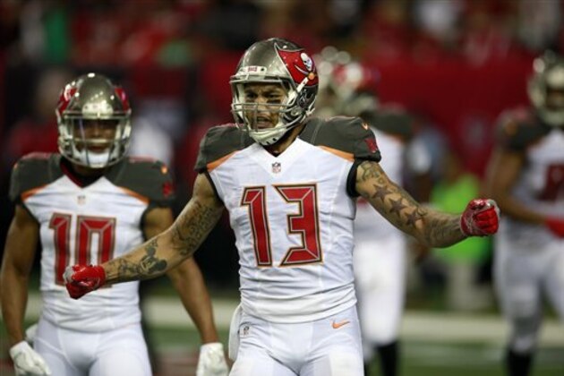 Tampa Bay Buccaneers wide receiver Mike Evans (13) celebrates after a touchdown catch against the Atlanta Falcons during an NFL football game, Sunday, Sept. 11, 2016, in Atlanta. The Buccaneers won the game 31-24.    (Jeff Haynes/AP Images for Panini)