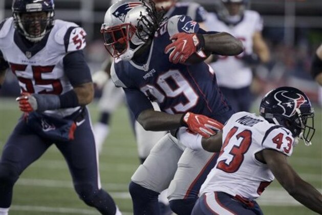 New England Patriots running back LeGarrette Blount (29) shakes an attempted tackle by Houston Texans defensive back Corey Moore (43) during the second half of an NFL divisional playoff football game, Saturday, Jan. 14, 2017, in Foxborough, Mass. (AP Photo/Steven Senne)
