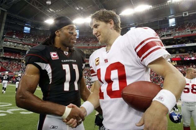 Arizona Cardinals' Larry Fitzgerald (11) and New York Giants' Eli Manning (10) shake hands after an NFL football game, Sunday, Oct. 2, 2011, in Glendale, Ariz.  The Giants defeated the Cardinals 31-27. (AP Photo/Ross D. Franklin)