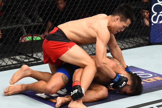 HOUSTON, TX - FEBRUARY 04:  (L-R) Chan Sung Jung of South Korea punches Dennis Bermudez in their featherweight bout during the UFC Fight Night event at the Toyota Center on February 4, 2017 in Houston, Texas. (Photo by Jeff Bottari/Zuffa LLC/Zuffa LLC via Getty Images)