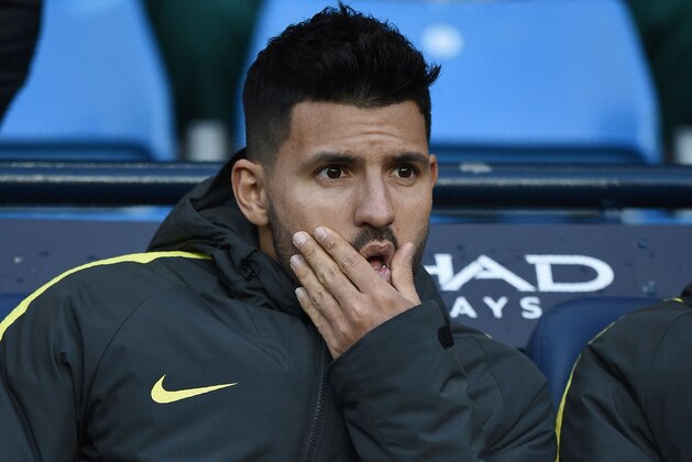 Manchester City's Argentinian striker Sergio Aguero reacts as he sits on the bench during the English Premier League football match between Manchester City and Burnley at the Etihad Stadium in Manchester, north west England, on January 2, 2017. / AFP / Oli SCARFF / RESTRICTED TO EDITORIAL USE. No use with unauthorized audio, video, data, fixture lists, club/league logos or 'live' services. Online in-match use limited to 75 images, no video emulation. No use in betting, games or single club/league/player publications.  /         (Photo credit should read OLI SCARFF/AFP/Getty Images)