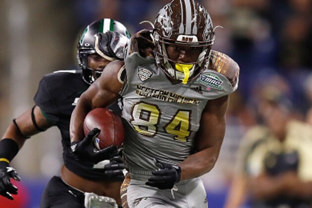 DETROIT, MI - DECEMBER 02: Corey Davis #84 of the Western Michigan Broncos outruns the tackle of Javon Hagan #7 of the Ohio Bobcats after a first half catch during the MAC Championship on December 2, 2016 at Ford Field in Detroit, Michigan. (Photo by Gregory Shamus/Getty Images)