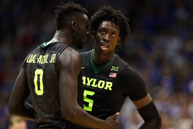 LAWRENCE, KS - FEBRUARY 01:  Jo Lual-Acuil Jr. #0 talks with Johnathan Motley #5 of the Baylor Bears during the game against the Kansas Jayhawks at Allen Fieldhouse on February 1, 2017 in Lawrence, Kansas.  (Photo by Jamie Squire/Getty Images)