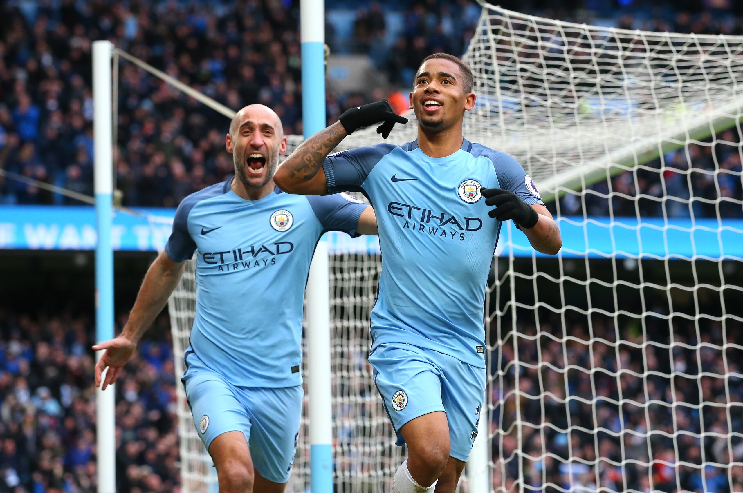 MANCHESTER, ENGLAND - FEBRUARY 05:  Gabriel Jesus of Manchester City (R) celebrates scoring his sides second goal with Pablo Zabaleta during the Premier League match between Manchester City and Swansea City at Etihad Stadium on February 5, 2017 in Manchester, England.  (Photo by Alex Livesey/Getty Images)