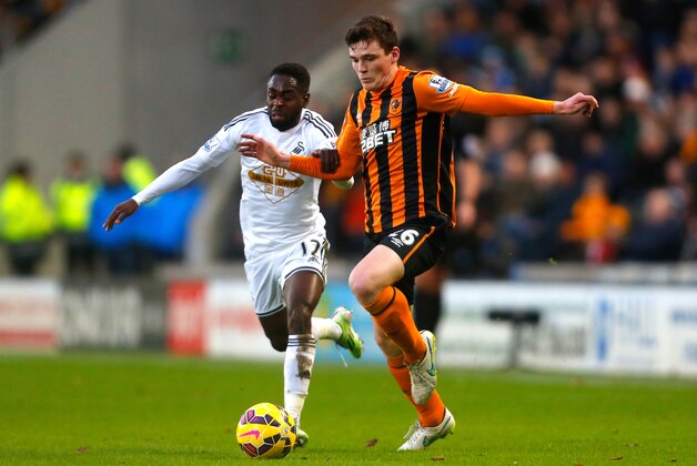 HULL, ENGLAND - DECEMBER 20:  Andy Robertson of Hull City competes with Nathan Dyer of Swansea City during the Barclays Premier League match between Hull City and Swansea City at KC Stadium on December 20, 2014 in Hull, England.  (Photo by Paul Thomas/Getty Images)