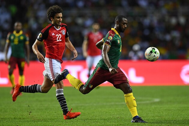 Egypt's midfielder Amr Warda (L) vies for the ball against Cameroon's defender Nicolas Nkoulou during the 2017 Africa Cup of Nations final football match between Egypt and Cameroon at the Stade de l'Amitie Sino-Gabonaise in Libreville on February 5, 2017. / AFP / GABRIEL BOUYS        (Photo credit should read GABRIEL BOUYS/AFP/Getty Images)