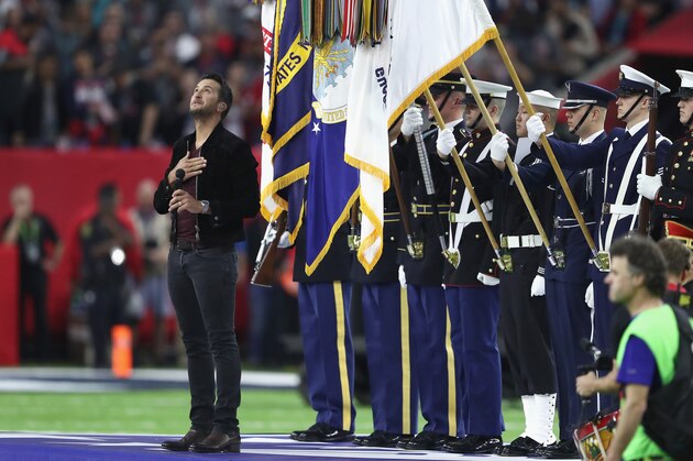 HOUSTON, TX - FEBRUARY 05:  Musician Luke Bryan sings the national anthem prior to Super Bowl 51 between the Atlanta Falcons and the New England Patriots at NRG Stadium on February 5, 2017 in Houston, Texas.  (Photo by Elsa/Getty Images)