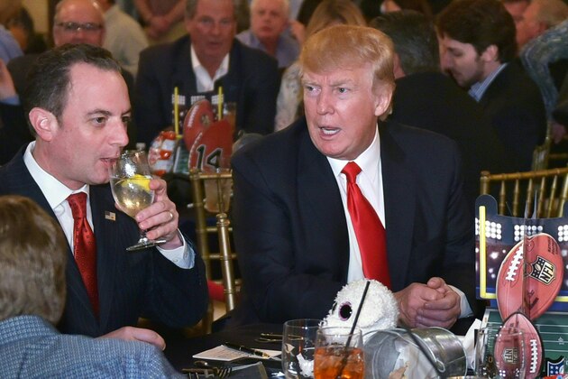 US President Donald Trump chats with White House Chief of Staff Reince Priebus while watching Super Bowl LI at Trump International Golf Club Palm Beach in West Palm Beach, Florida on February 5, 2017. / AFP / MANDEL NGAN        (Photo credit should read MANDEL NGAN/AFP/Getty Images)