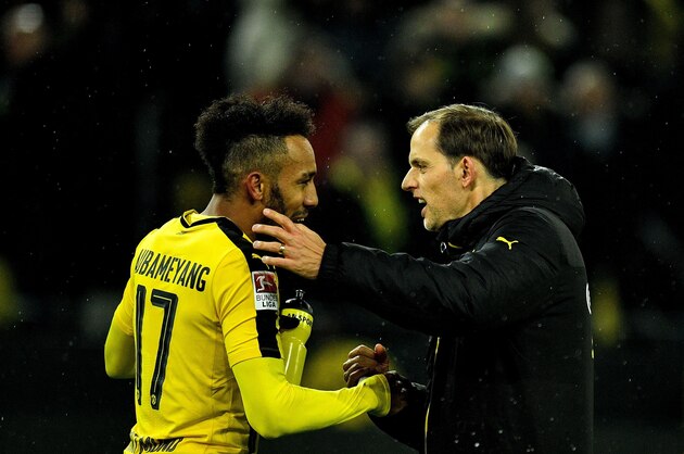 Dortmund's head coach Thomas Tuchel celebrates with Dortmund's Gabonese forward Pierre-Emerick Aubameyang after the German First division Bundesliga football match between Borussia Dortmund and RB Leipzig, in Dortmund, western Germany, on February 4, 2017.  / AFP / SASCHA SCHUERMANN / RESTRICTIONS: DURING MATCH TIME: DFL RULES TO LIMIT THE ONLINE USAGE TO 15 PICTURES PER MATCH AND FORBID IMAGE SEQUENCES TO SIMULATE VIDEO. == RESTRICTED TO EDITORIAL USE == FOR FURTHER QUERIES PLEASE CONTACT DFL DIRECTLY AT + 49 69 650050
        (Photo credit should read SASCHA SCHUERMANN/AFP/Getty Images)