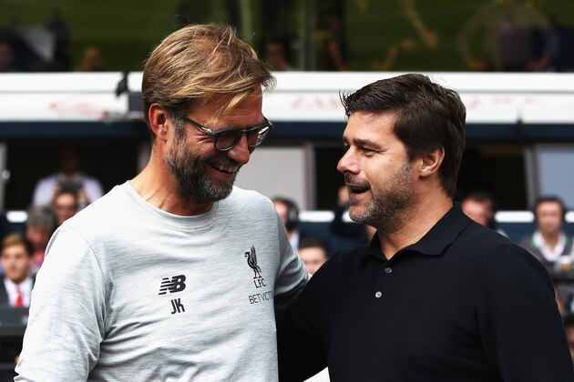 LONDON, ENGLAND - AUGUST 27: Jurgen Klopp, Manager of Liverpool and Mauricio Pochettino, Manager of Tottenham Hotspur exchange words piror to kick off during the Premier League match between Tottenham Hotspur and Liverpool at White Hart Lane on August 27, 2016 in London, England.  (Photo by Jan Kruger/Getty Images)
