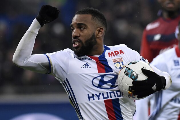 Lyon's French forward Alexandre Lacazette celebrates after scoring a penalty  during the French L1 football match Olympique Lyonnais (OL) against Lille (LOSC) on January 28, 2017, at the Parc Olympique Lyonnais stadium in Decines-Charpieu near Lyon, central-eastern France.    / AFP / PHILIPPE DESMAZES        (Photo credit should read PHILIPPE DESMAZES/AFP/Getty Images)