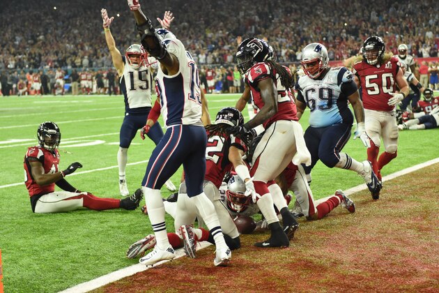 TOPSHOT - James White #28 of the New England Patriots scores the game winning touchdown in overtime against the Atlanta Falcons during Super Bowl 51 at NRG Stadium on February 5, 2017 in Houston, Texas   / AFP / Timothy A. CLARY        (Photo credit should read TIMOTHY A. CLARY/AFP/Getty Images)