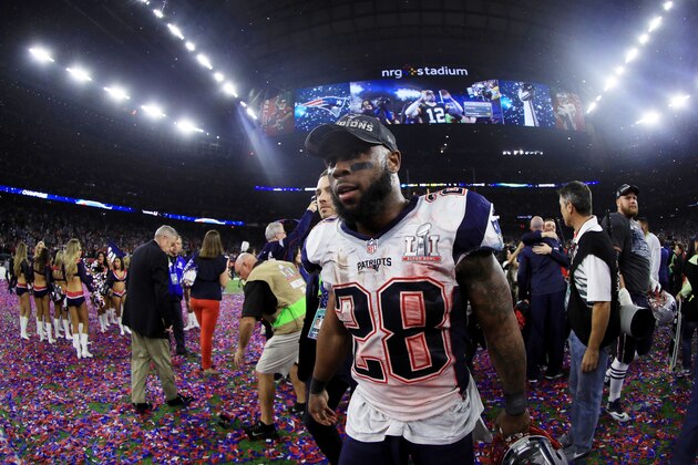 HOUSTON, TX - FEBRUARY 05:  James White #28 of the New England Patriots walks on the field after defeating the Atlanta Falcons 34-28 in overtime during Super Bowl 51 at NRG Stadium on February 5, 2017 in Houston, Texas.  (Photo by Mike Ehrmann/Getty Images)