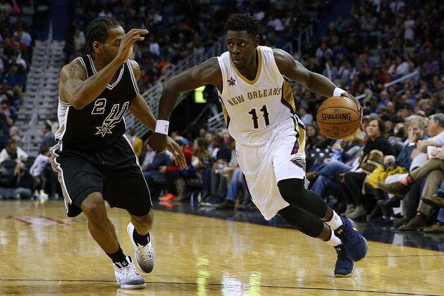 NEW ORLEANS, LA - JANUARY 27: Jrue Holiday #11 of the New Orleans Pelicans drives against Kawhi Leonard #2 of the San Antonio Spurs during the second half of a game at the Smoothie King Center on January 27, 2017 in New Orleans, Louisiana. NOTE TO USER: User expressly acknowledges and agrees that, by downloading and or using this photograph, User is consenting to the terms and conditions of the Getty Images License Agreement.  (Photo by Jonathan Bachman/Getty Images)