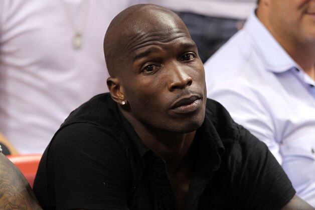 MIAMI, FL - MAY 24:  Chad 'Ochocinco' Johnson watches the Miami Heat play against the Chicago Bulls in Game Four of the Eastern Conference Finals during the 2011 NBA Playoffs on May 24, 2011 at American Airlines Arena in Miami, Florida. NOTE TO USER: User expressly acknowledges and agrees that, by downloading and or using this photograph, User is consenting to the terms and conditions of the Getty Images License Agreement.  (Photo by Mike Ehrmann/Getty Images)