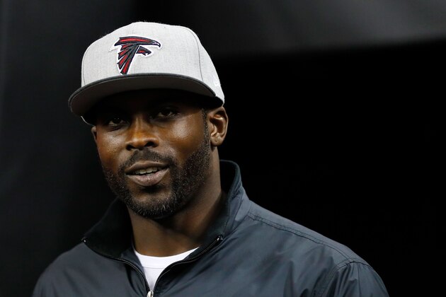 ATLANTA, GA - JANUARY 01: Former Atlanta Falcons player Michael Vick walks on the field prior to the game against the New Orleans Saints at the Georgia Dome on January 1, 2017 in Atlanta, Georgia. (Photo by Kevin C.  Cox/Getty Images)