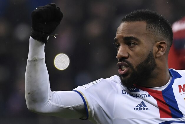 Lyon's French forward Alexandre Lacazette celebrates after scoring a penalty  during the French L1 football match Olympique Lyonnais (OL) against Lille (LOSC) on January 28, 2017, at the Parc Olympique Lyonnais stadium in Decines-Charpieu near Lyon, central-eastern France.    / AFP / PHILIPPE DESMAZES        (Photo credit should read PHILIPPE DESMAZES/AFP/Getty Images)