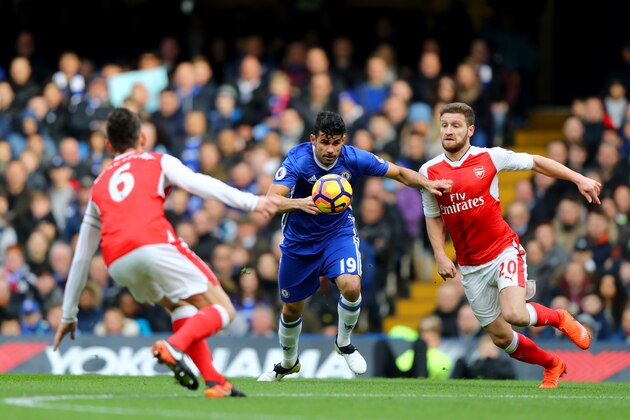 LONDON, ENGLAND - FEBRUARY 04:  Diego Costa of Chelsea battles for the ball with Shkodran Mustafi of Arsenal during the Premier League match between Chelsea and Arsenal at Stamford Bridge on February 4, 2017 in London, England.  (Photo by Clive Rose/Getty Images)