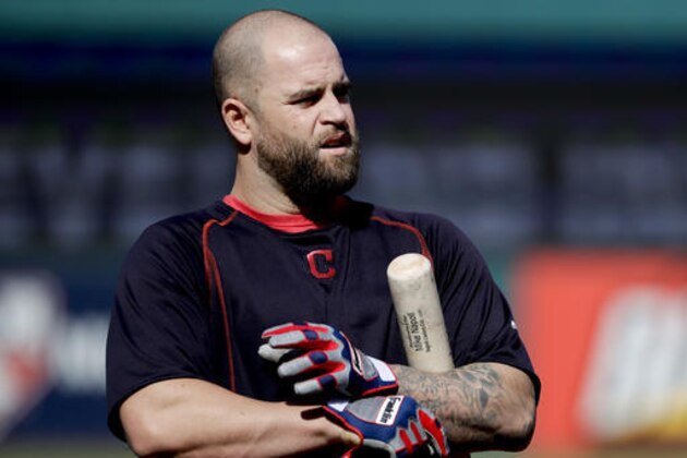 Cleveland Indians first baseman Mike Napoli warms up during batting practice before Game 2 of baseball's American League Championship Series against the Toronto Blue Jays in Cleveland, Saturday, Oct. 15, 2016. (AP Photo/Matt Slocum)