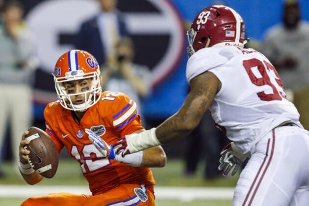 Florida quarterback Austin Appleby (12) is sacked by Alabama defensive lineman Jonathan Allen (93) during the first half of the Southeastern Conference championship NCAA college football game, Saturday, Dec. 3, 2016, in Atlanta.(AP Photo/Butch Dill)