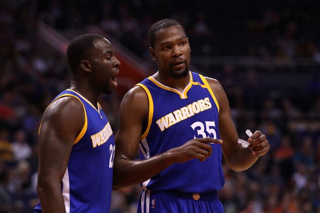 PHOENIX, AZ - OCTOBER 30:  Kevin Durant #35 of the Golden State Warriors talks with Draymond Green #23 during the second half of the NBA game against the Phoenix Suns at Talking Stick Resort Arena on October 30, 2016 in Phoenix, Arizona.  The Warriors defeated the Suns 106 -100. NOTE TO USER: User expressly acknowledges and agrees that, by downloading and or using this photograph, User is consenting to the terms and conditions of the Getty Images License Agreement.  (Photo by Christian Petersen/Getty Images)